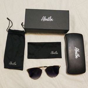 Abella action gold black sunglasses